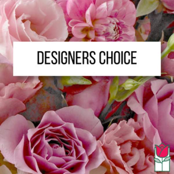 Pink roses and peony-like blooms behind a Designers Choice label