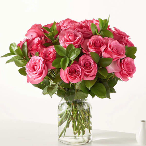 Pink rose bouquet in a clear glass vase