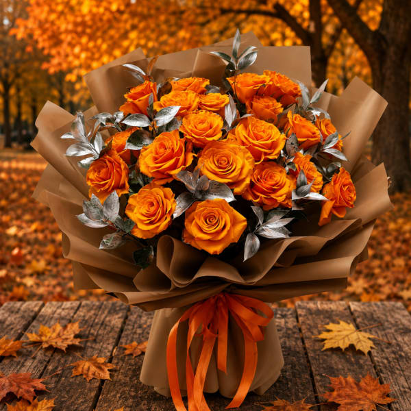 Bouquet of orange roses wrapped in brown paper with an orange ribbon
