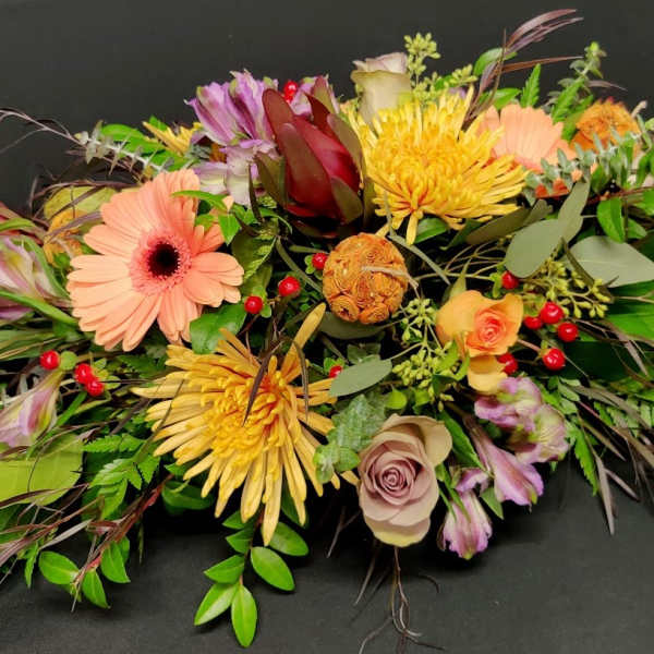 Long low medium autumn table centerpiece