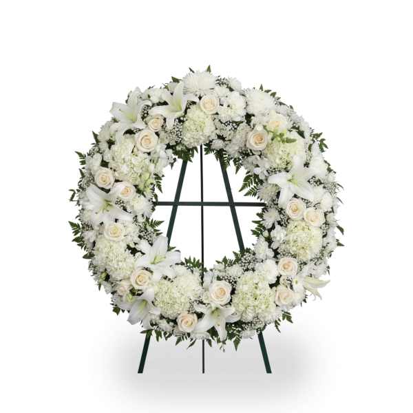 White floral wreath on a standing easel