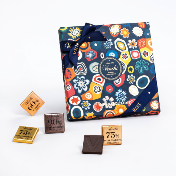 Gift box of assorted chocolates with a patterned wrap and ribbon