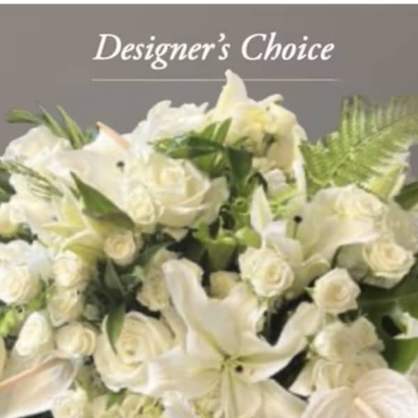 White floral arrangement with roses and lilies