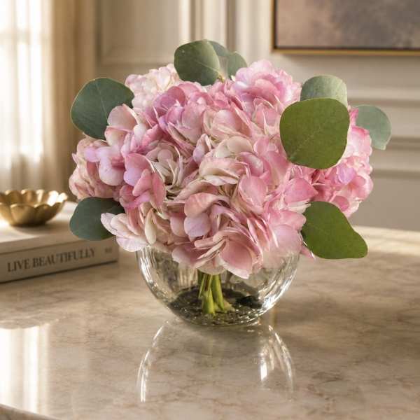 Pink hydrangea bouquet in a clear glass vase