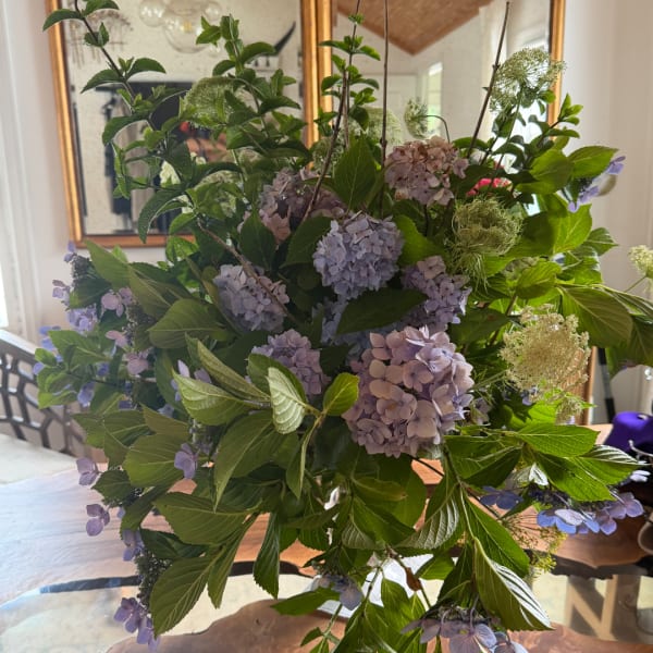 Large bouquet of lavender hydrangeas and green foliage
