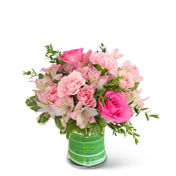 Pink roses and carnations in a green striped glass vase