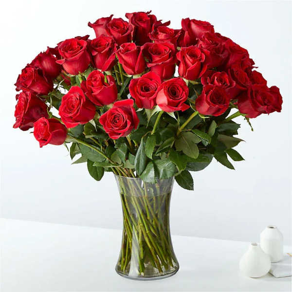 Bouquet of red roses in a clear glass vase