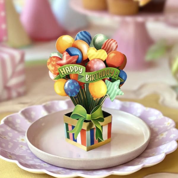 Mini birthday balloon bouquet in a striped gift box