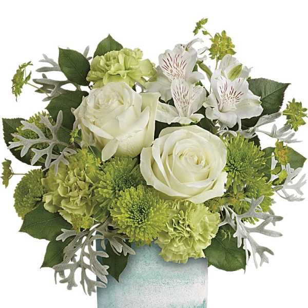 White roses and green flowers in a blue-green vase