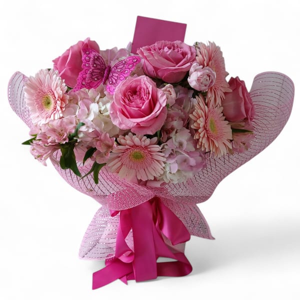 Pink rose and gerbera bouquet with a butterfly decoration and ribbon wrap
