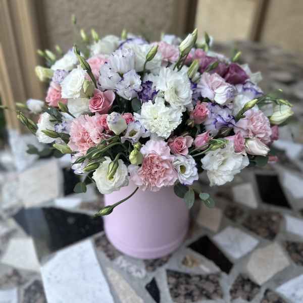 Pink and white bouquet in a pastel pink hat box