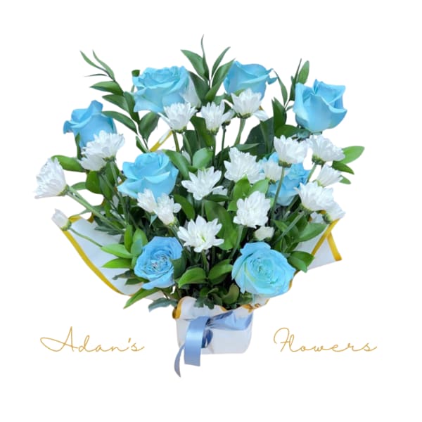 Blue roses and white daisies in a wrapped bouquet with a ribbon