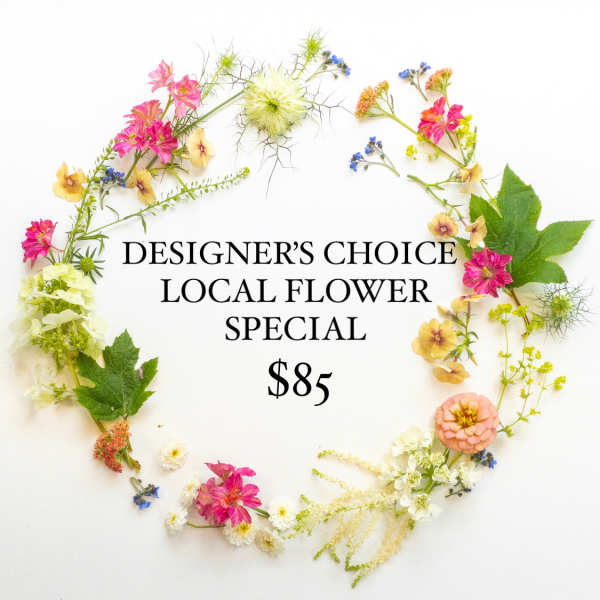Assorted small pink, yellow, and white flowers arranged in a loose circular frame around text on white background