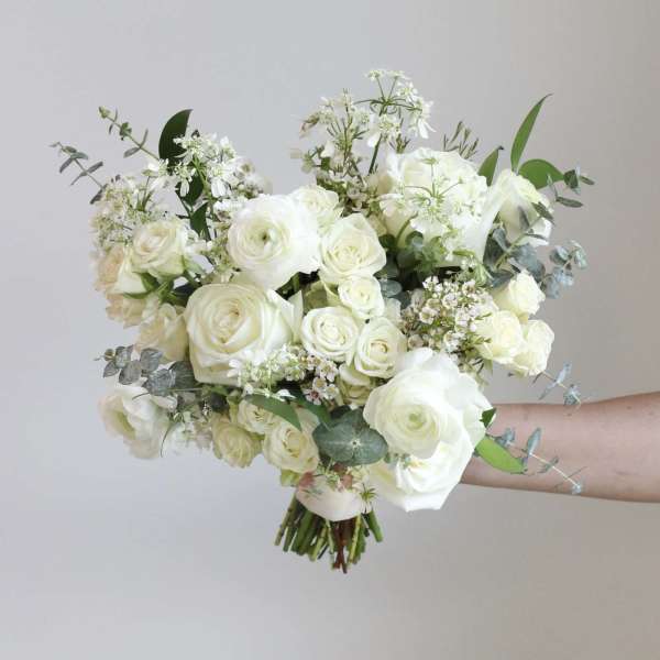 White rose bouquet with airy filler flowers and eucalyptus