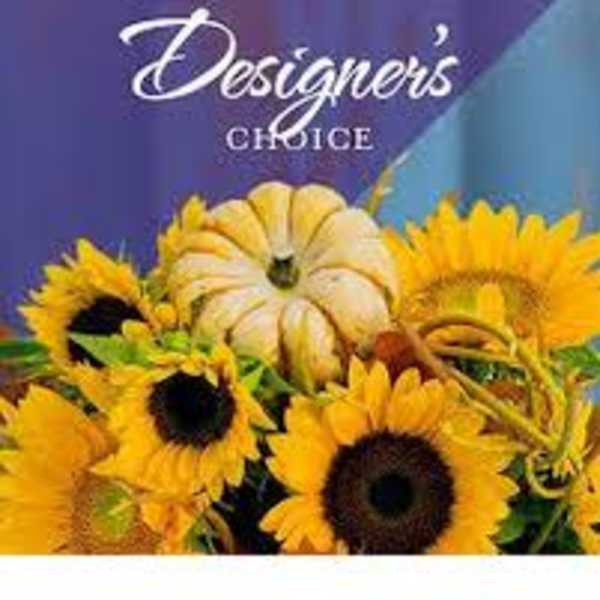 Sunflower arrangement with a decorative pumpkin centerpiece