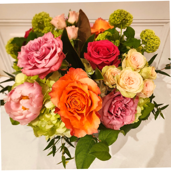 Mixed bouquet of roses, peonies, and green hydrangeas