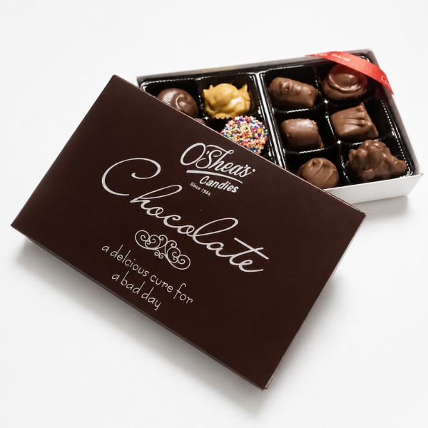 Box of assorted chocolates with the lid partially open