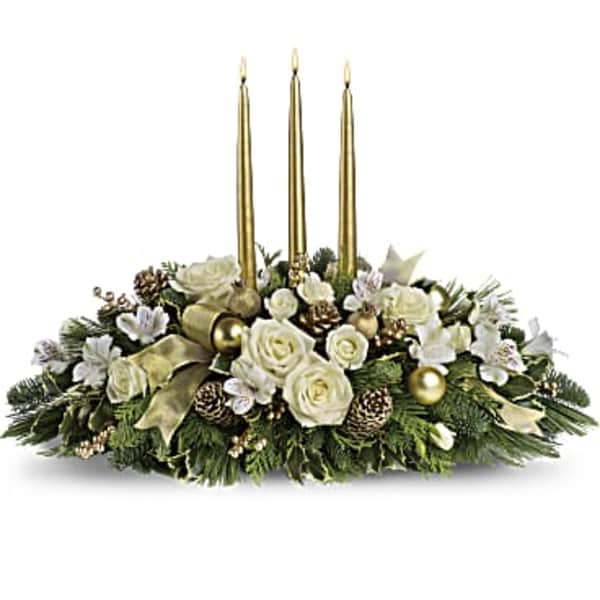 Holiday centerpiece with white roses and gold candles
