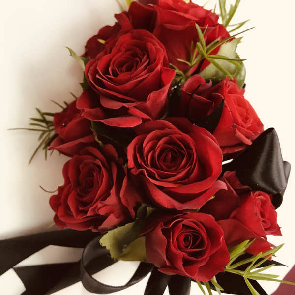 Bouquet of red roses with black ribbon