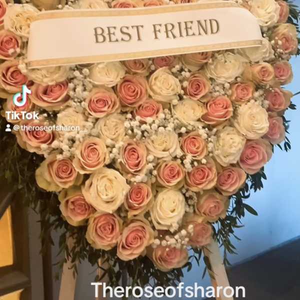 Heart-shaped rose arrangement with a "BEST FRIEND" ribbon