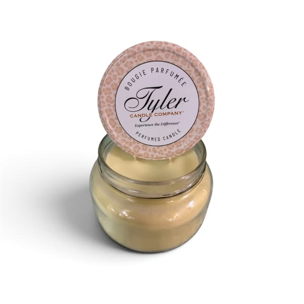 Scented candle in a glass jar with a round lid