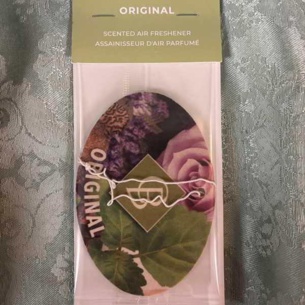 Packaged scented air freshener with a floral print