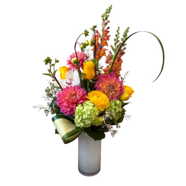 Colorful mixed bouquet in a tall glass vase