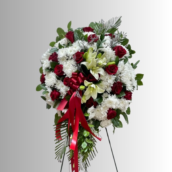 Standing floral spray with red roses, white chrysanthemums, and lilies