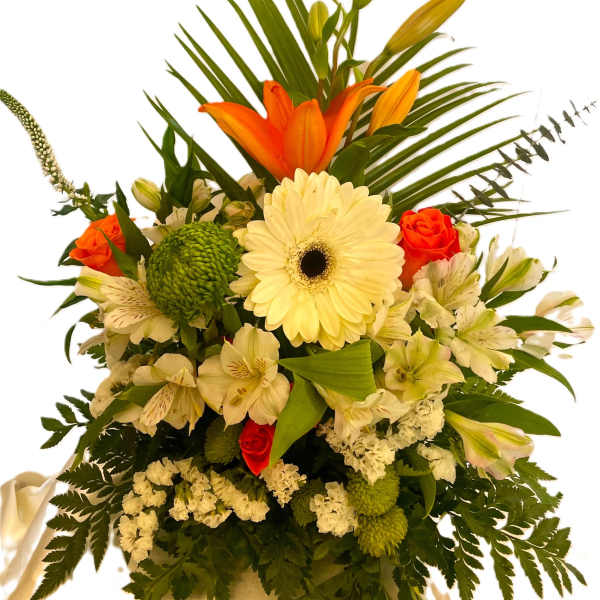 Mixed bouquet with orange lilies, white gerbera daisies, and cream flowers