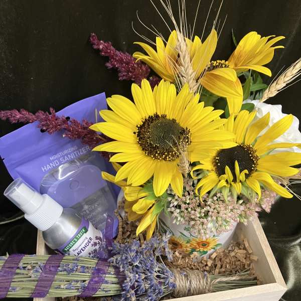 Sunflower arrangement in a wooden gift box with lavender items