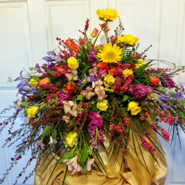 Large mixed bouquet with yellow sunflowers and colorful blooms