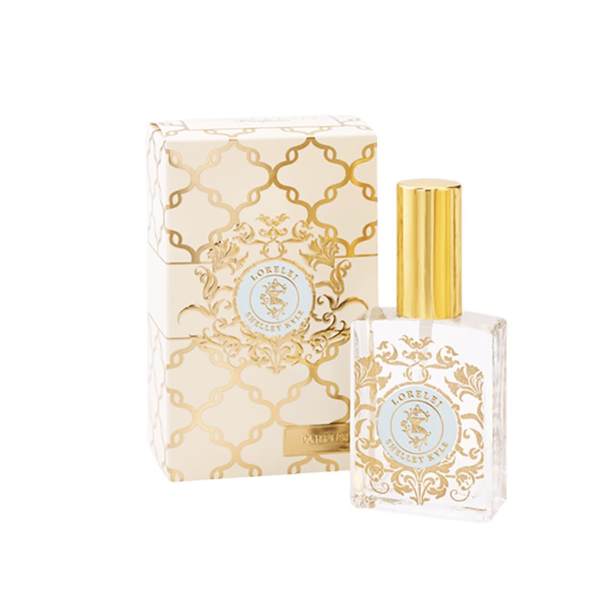Perfume bottle with gold cap beside matching decorative box