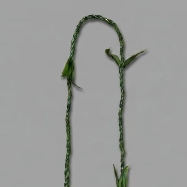 Braided green floral garland with small leaf accents on a gray background