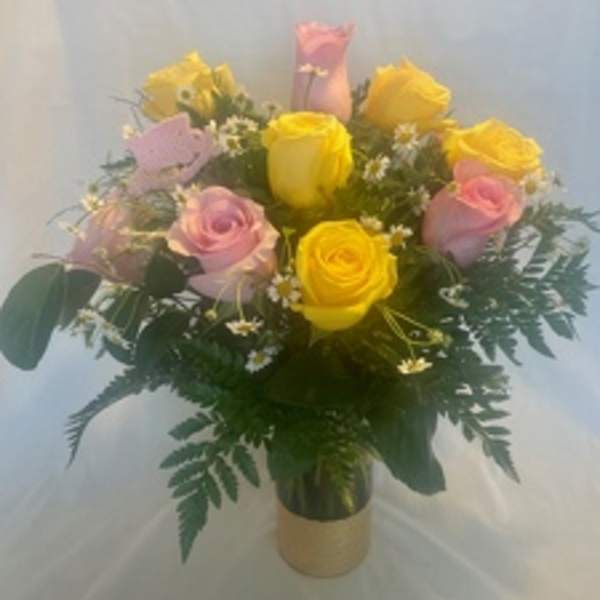 Bouquet of pink and yellow roses in a vase