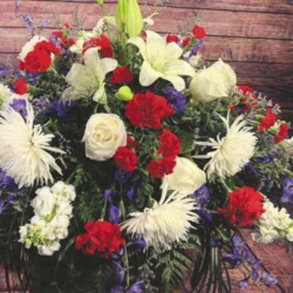 Large red, white, and purple floral spray with lilies and carnations
