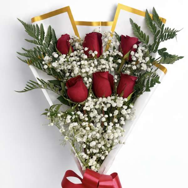 Bouquet of red roses and white baby's breath with a red ribbon