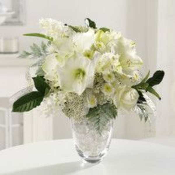 White floral arrangement in a clear glass vase