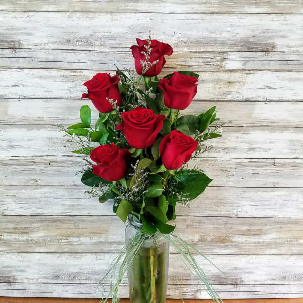 Bouquet of red roses in a glass vase