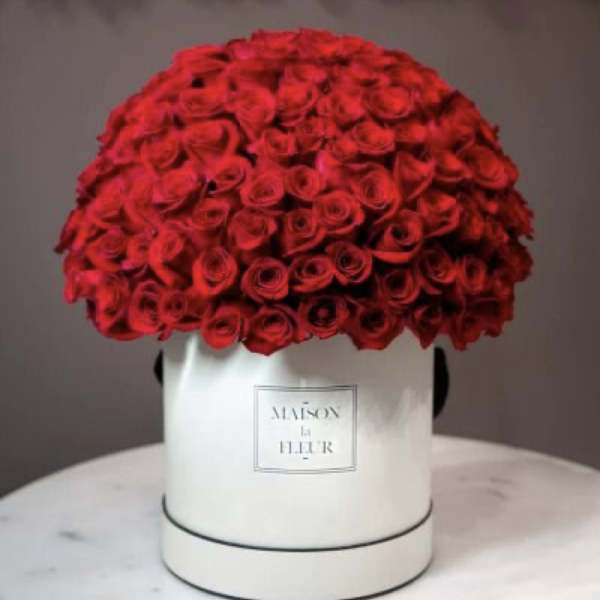 Large dome of red roses in a white hat box