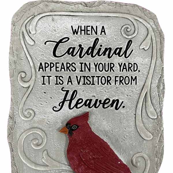 Decorative stone plaque with a red cardinal and memorial text