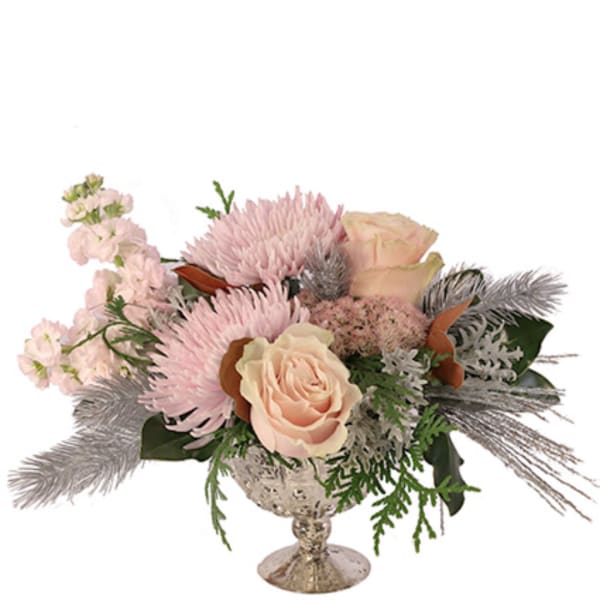 Pink and cream floral arrangement in a silver pedestal vase