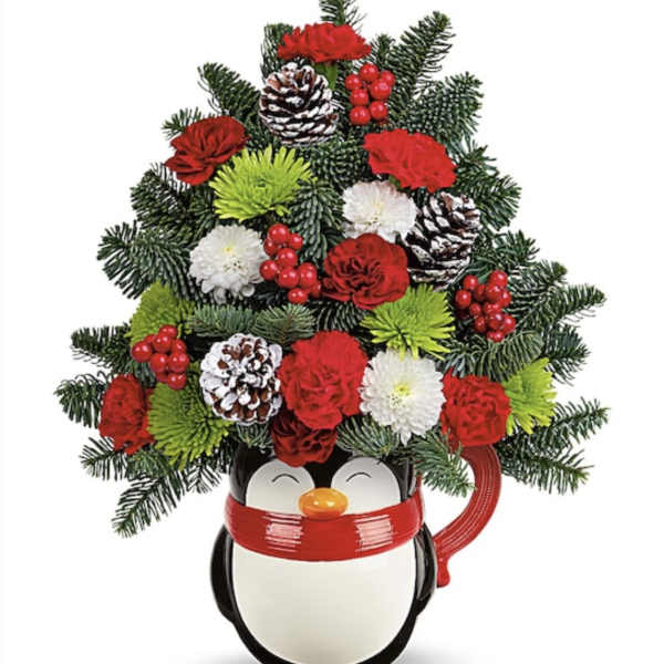 Penguin-shaped container holding a Christmas floral arrangement