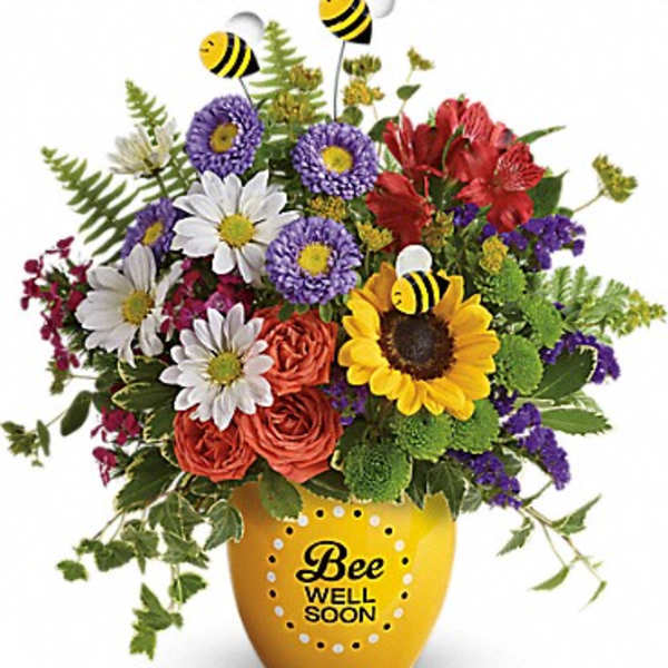 Colorful bouquet in a yellow vase with bee decorations and "Bee Well Soon" text