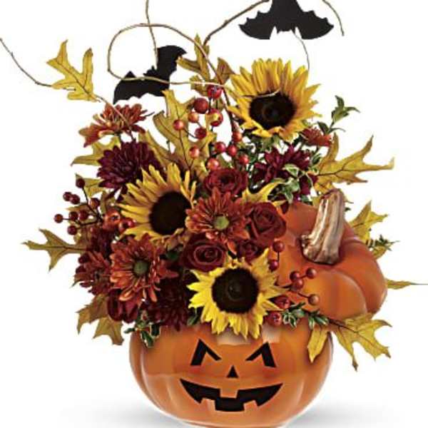 Halloween pumpkin container with sunflowers, mums, and bats