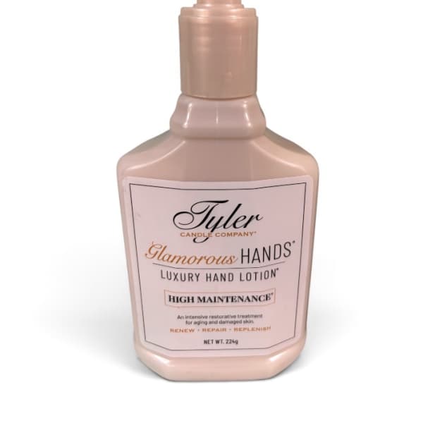 Pink pump bottle of hand lotion with a labeled front