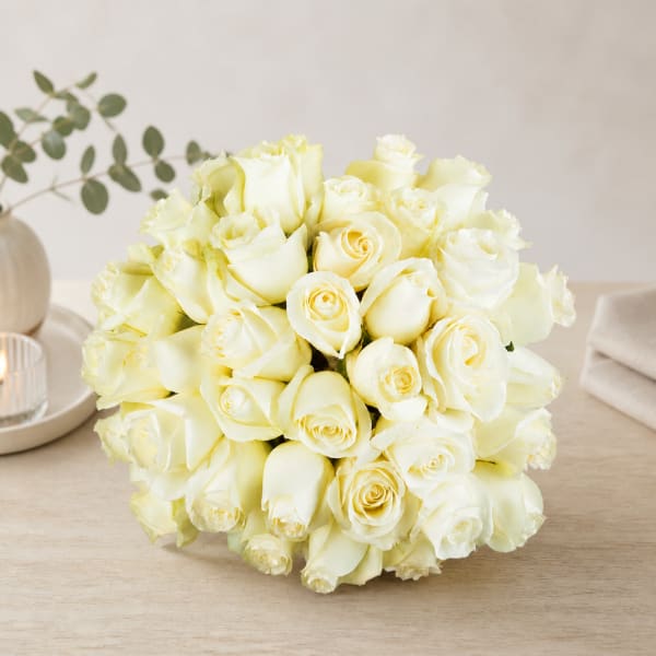 Bouquet of white roses on a tabletop
