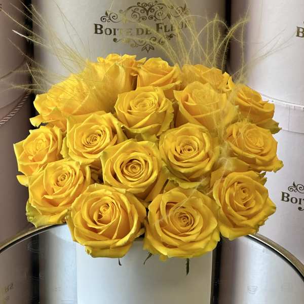 Yellow rose bouquet in a white round box