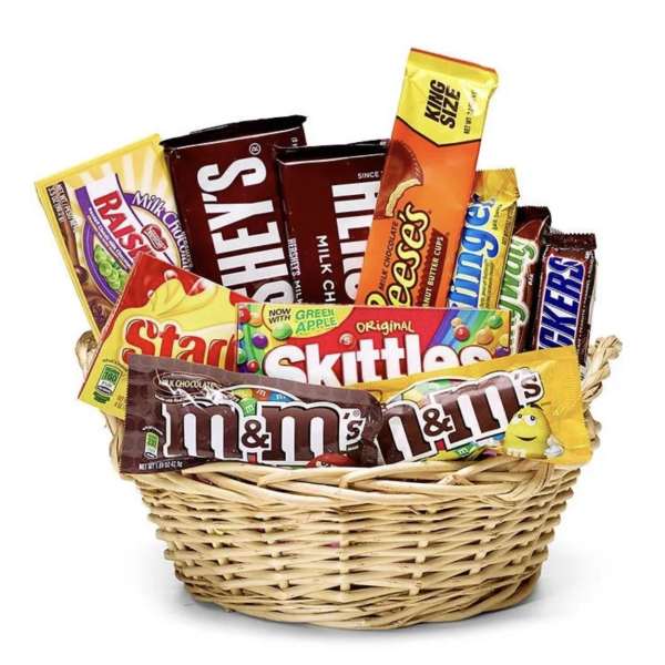Basket filled with assorted candy bars and sweets