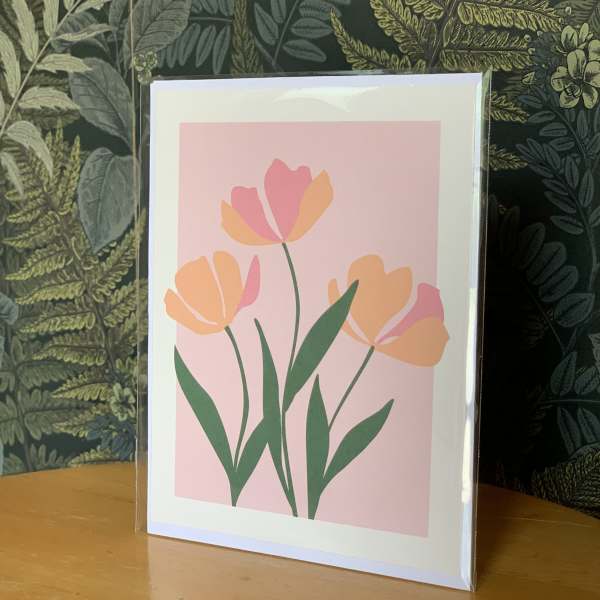 Framed floral print with pink and orange tulip-like flowers