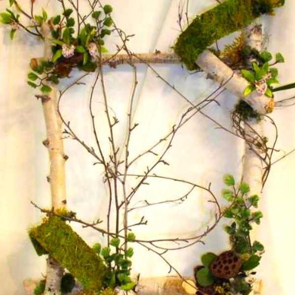 Rustic branch wreath with moss and small green accents